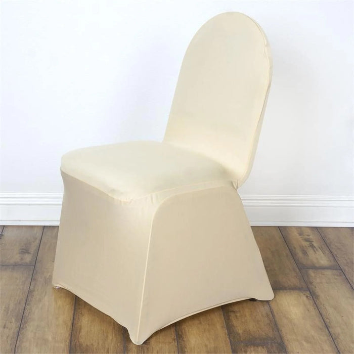 Beige chair cover on a plain chair against a white backdrop