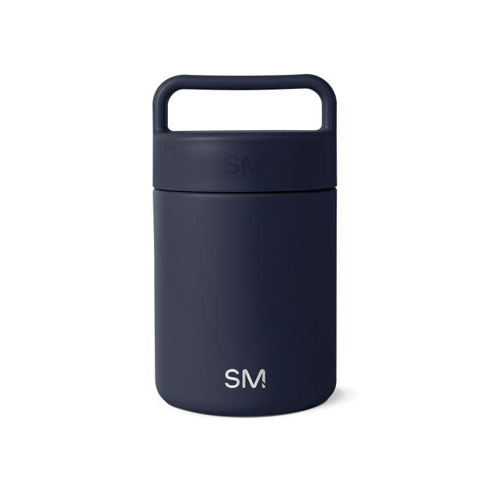 Navy blue glass jar with dark cap and handle on white background