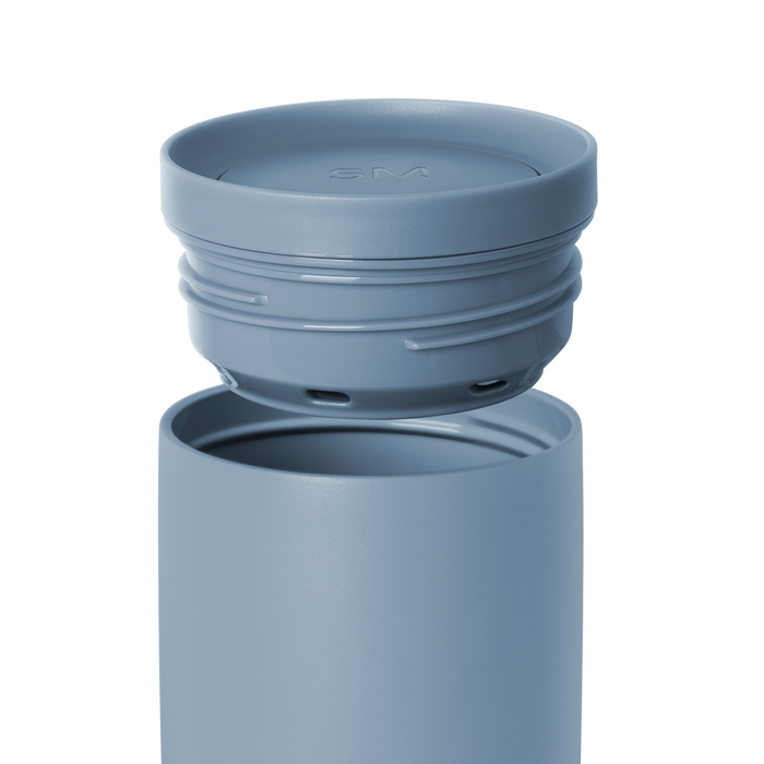 Blue-gray water bottle with detachable lid on white background. Simple modern design in muted slate blue color.